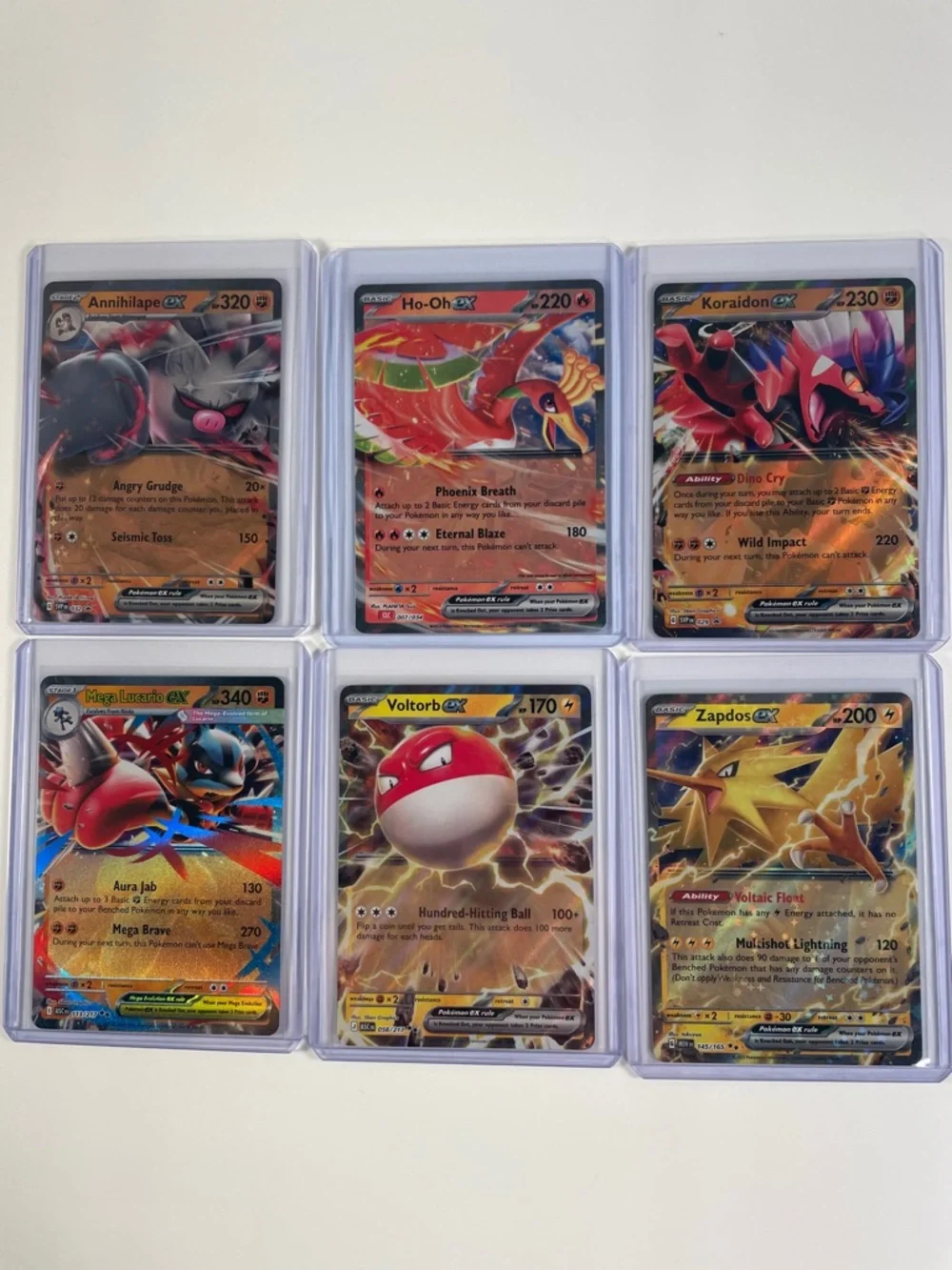 Pokémon EX Lot - Annihilape, Ho-Oh, Koraidon, Mega Lucario, Voltorb and Zapdos - Picture 1 of 8